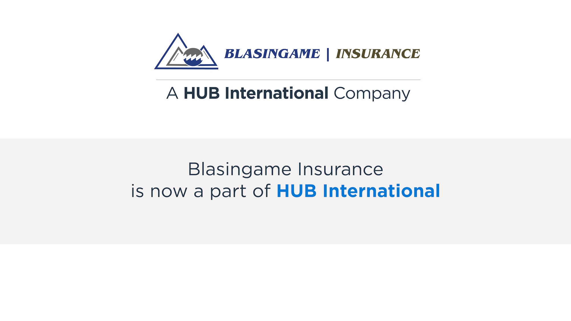 Couple sitting together on couch looking at laptop